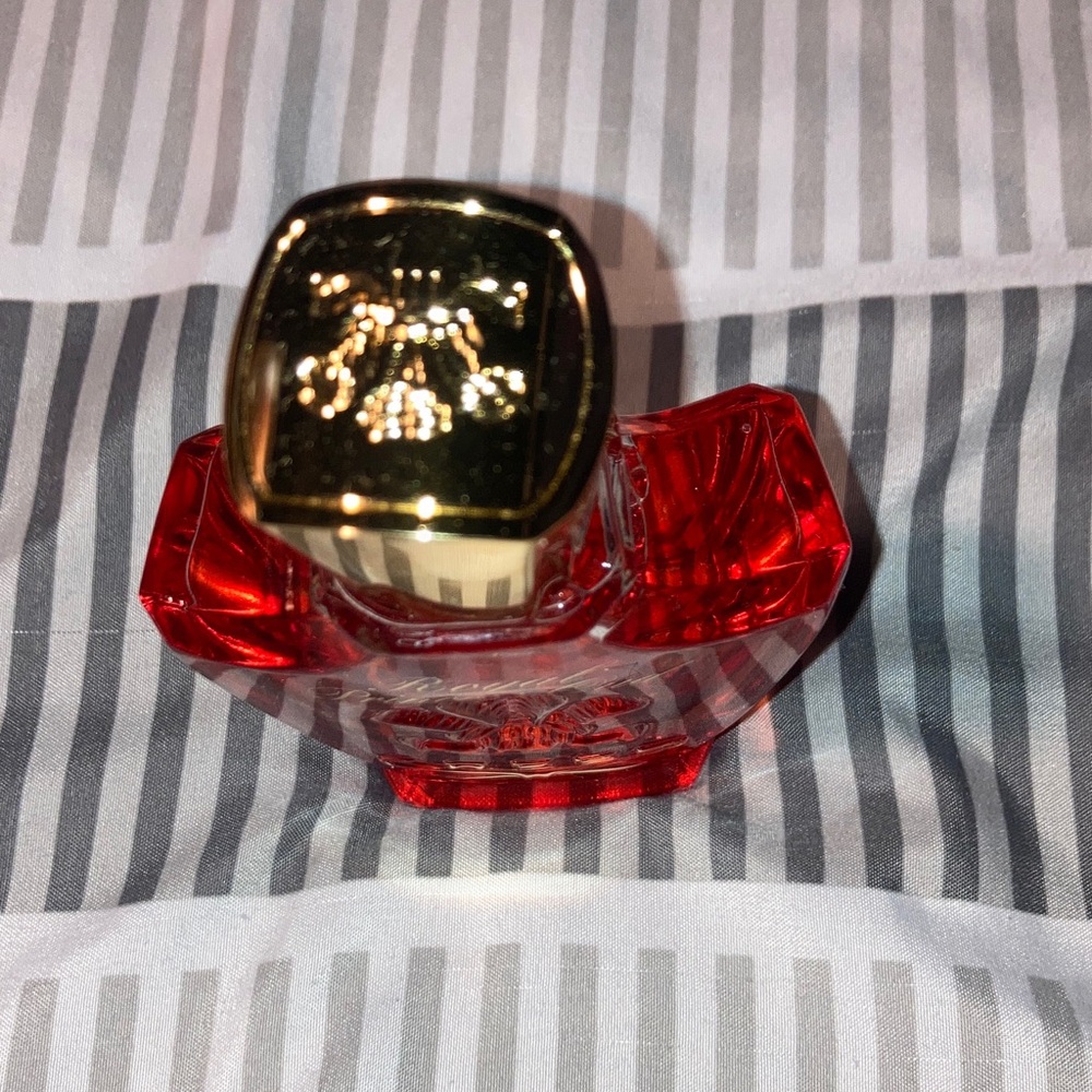 New Creed Gradient Red and Gold Perfume.